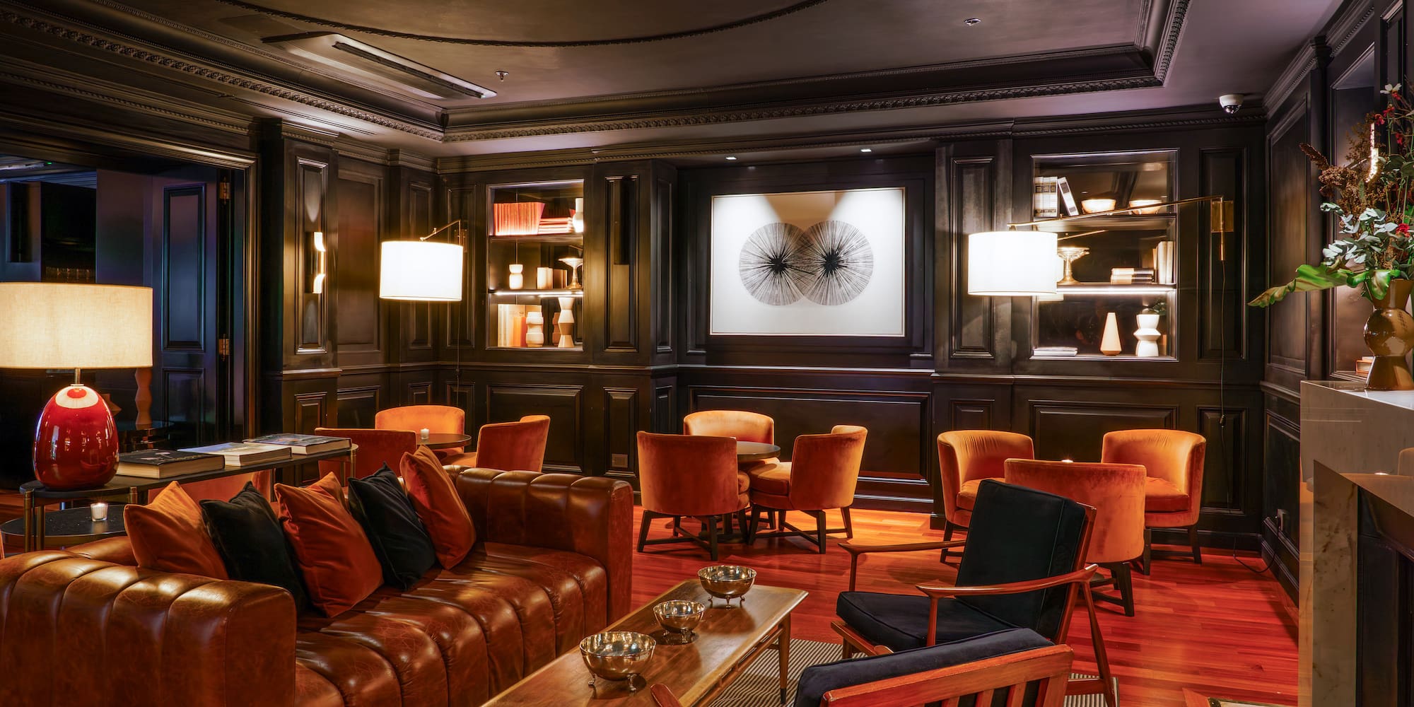 a room with a couch and chairs