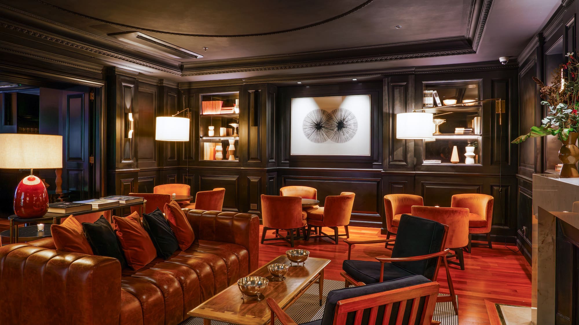 a room with a couch and chairs