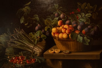 a painting of fruit in a basket