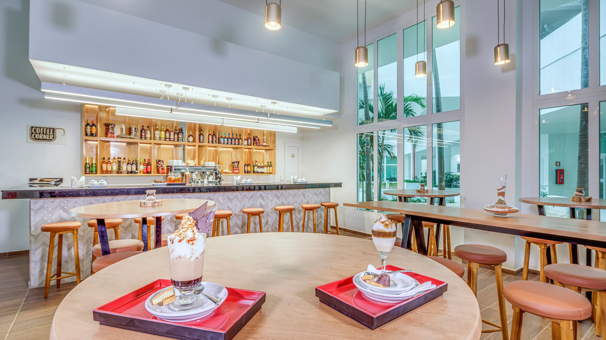 a room with tables and chairs and a bar