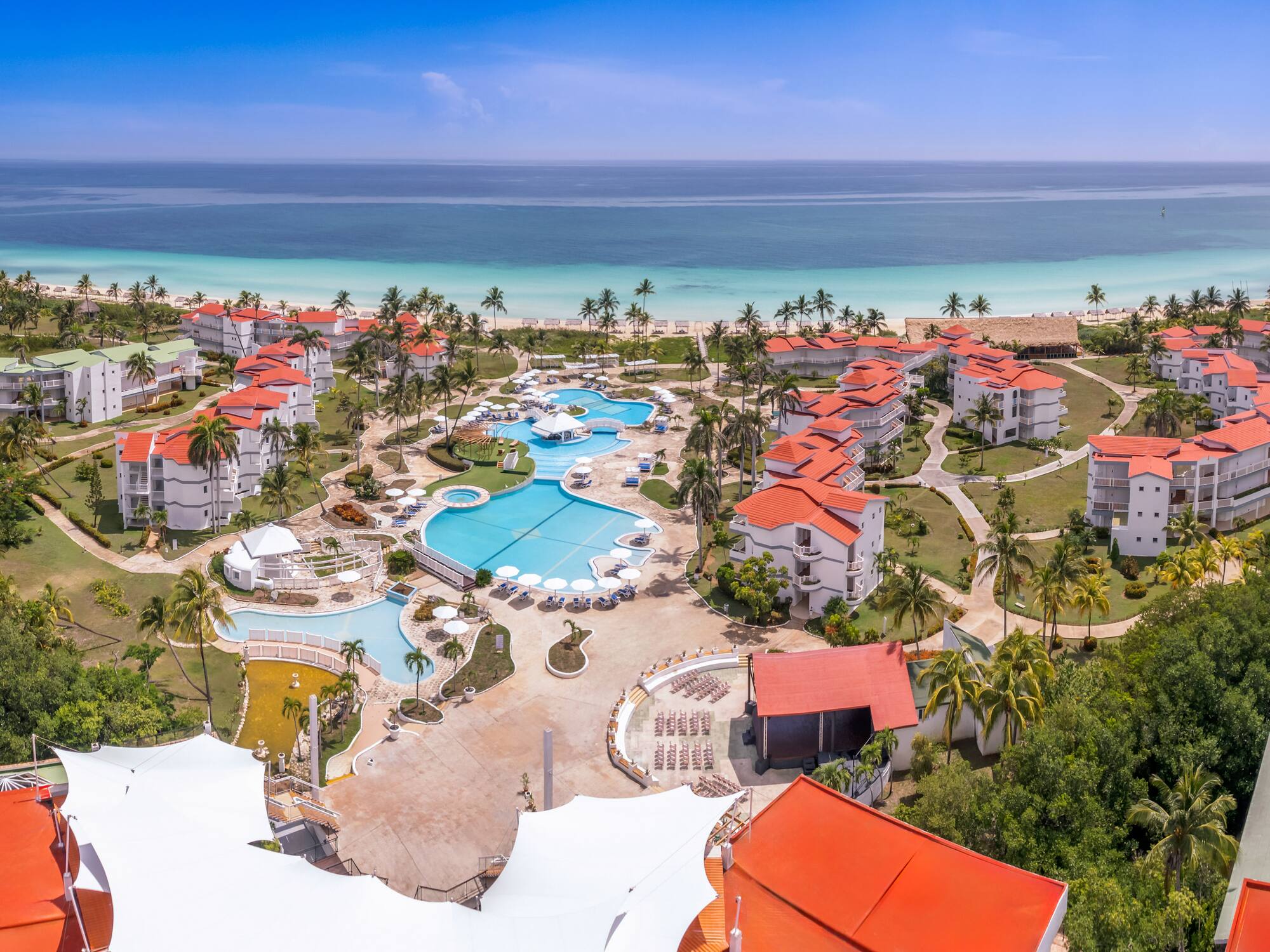 a resort with a pool and a beach