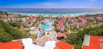a resort with a pool and a beach