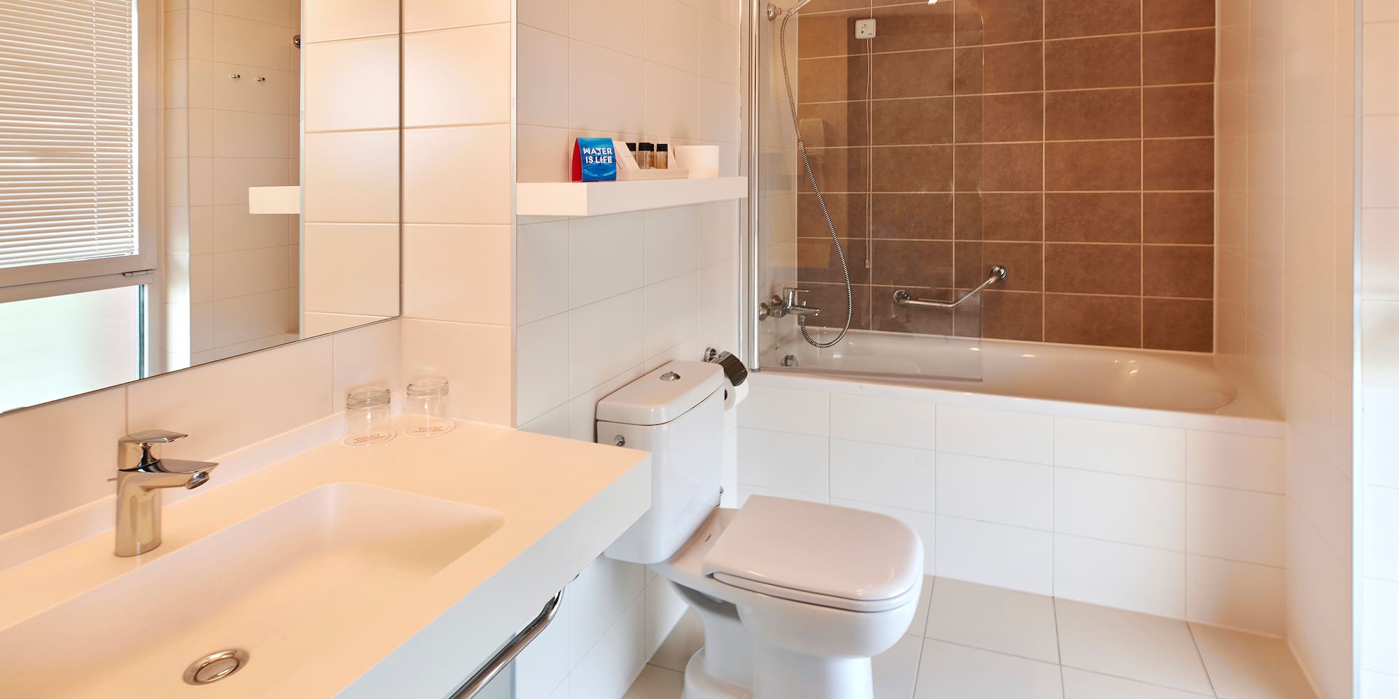 a bathroom with a shower and toilet