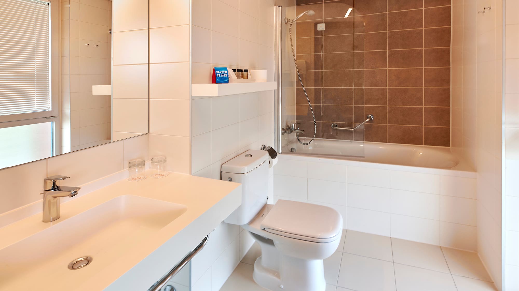 a bathroom with a shower and toilet