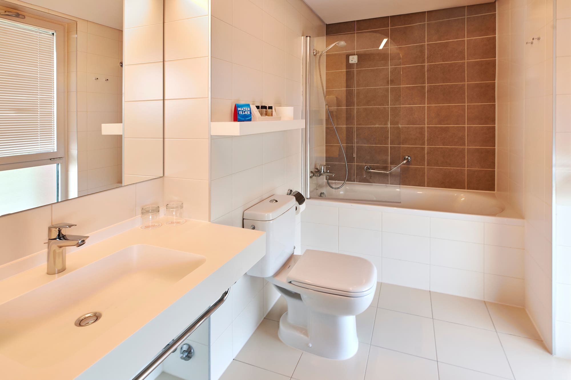 a bathroom with a shower and toilet