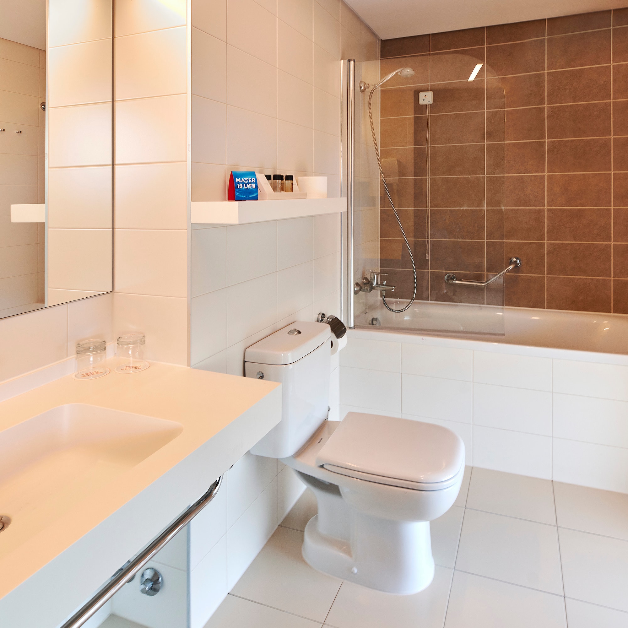 a bathroom with a shower and toilet