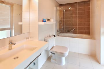 a bathroom with a shower and toilet