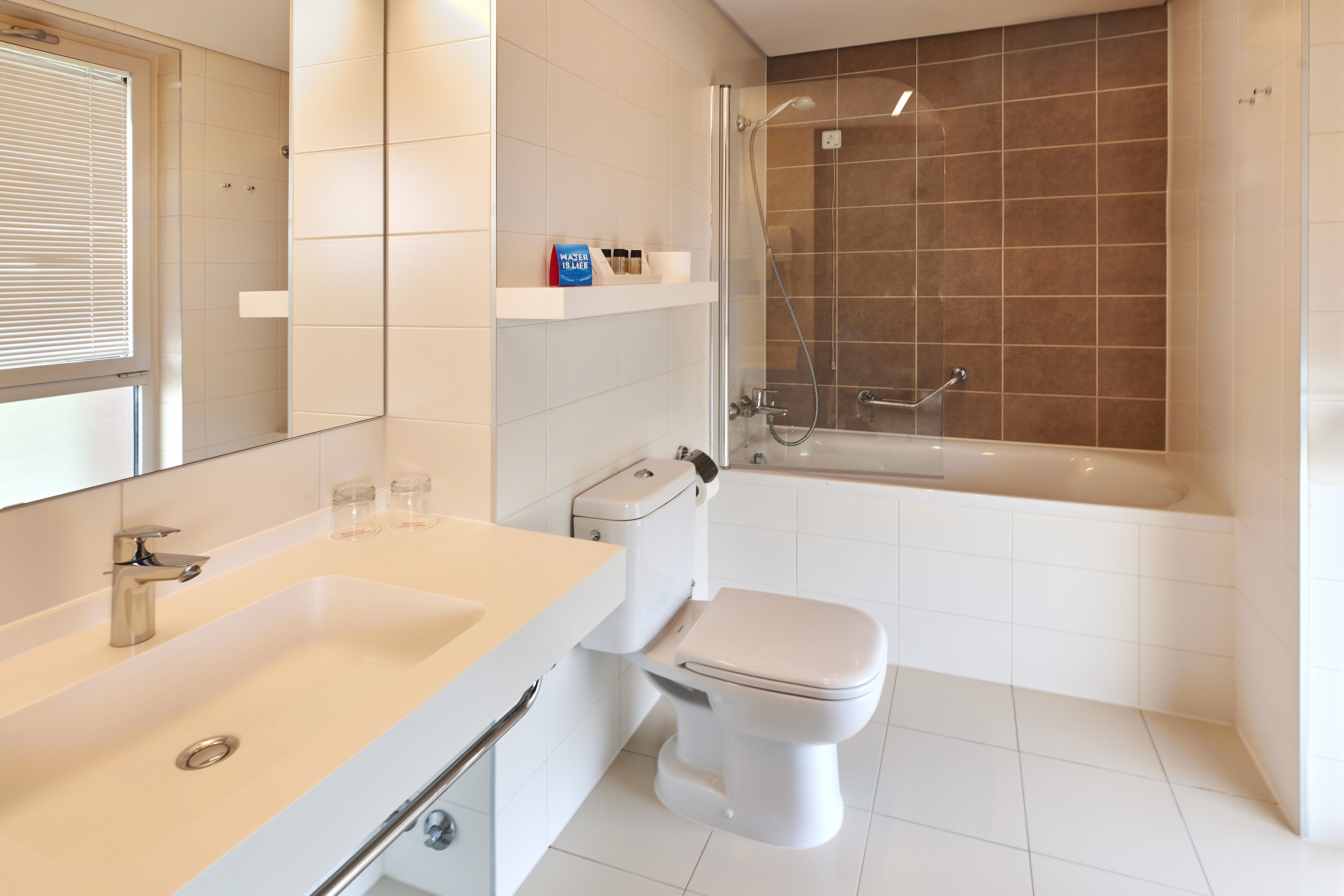 a bathroom with a shower and toilet