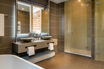 a bathroom with a shower and sink