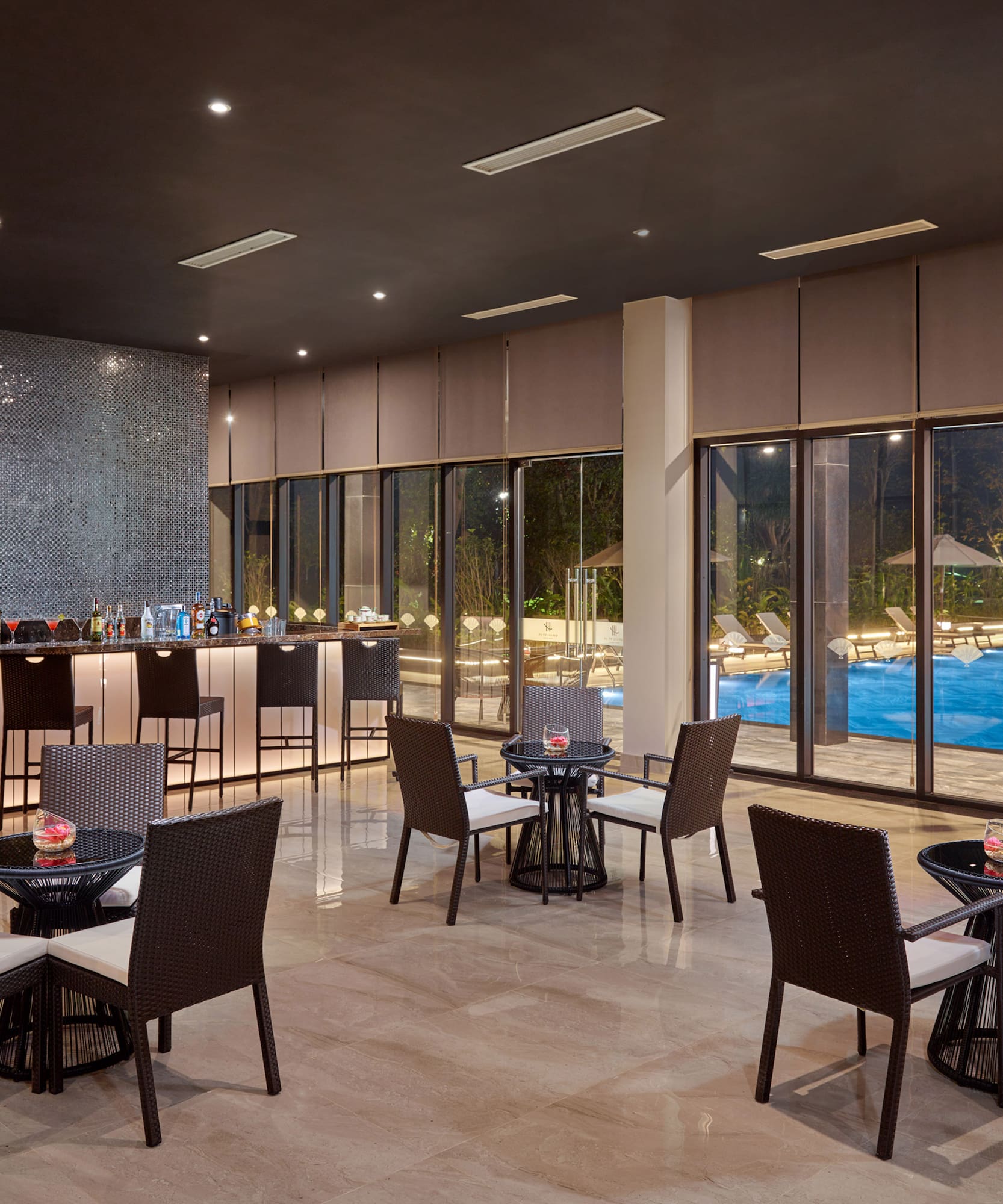 a room with a bar and chairs