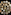 Assortment of Chinese dim sum in bamboo steamers on black background.