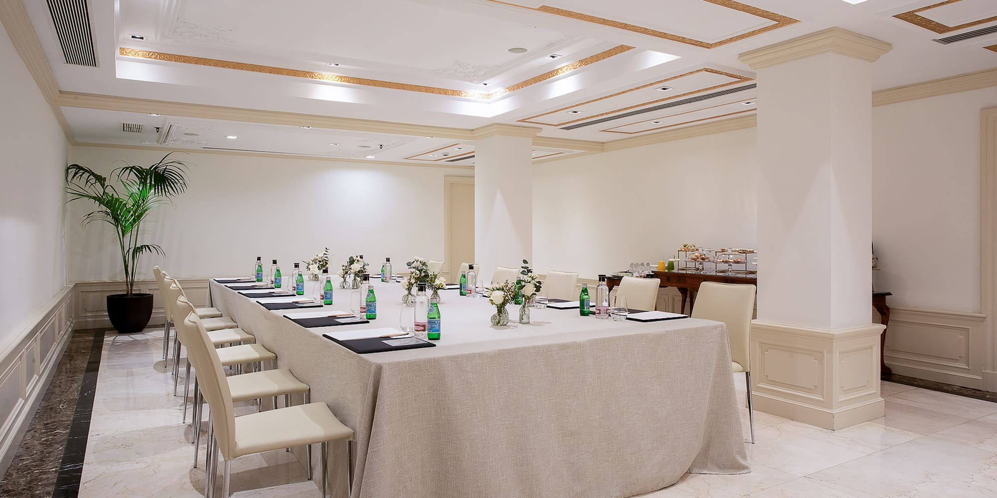 a long table with drinks and bottles on it