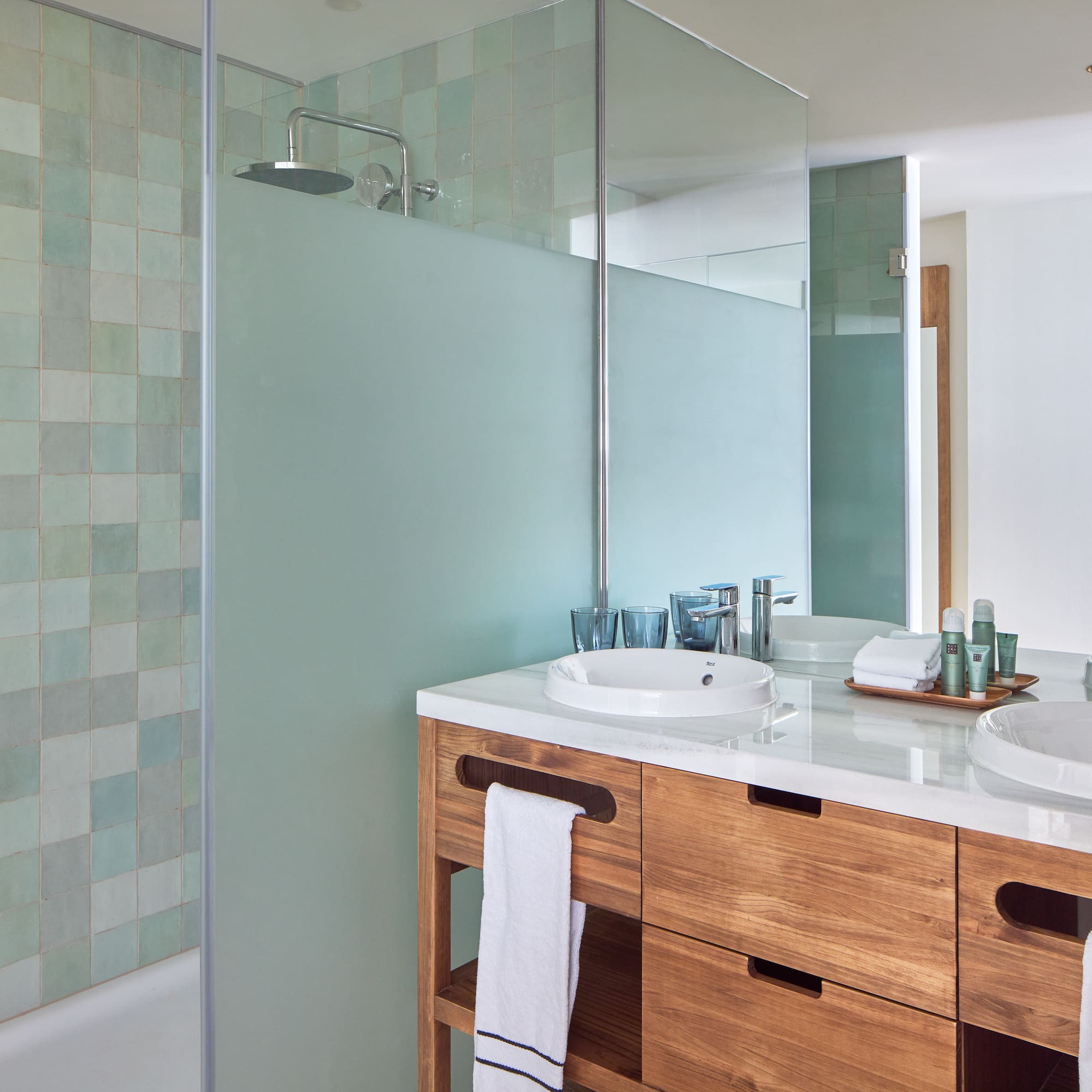 a bathroom with a shower and sink