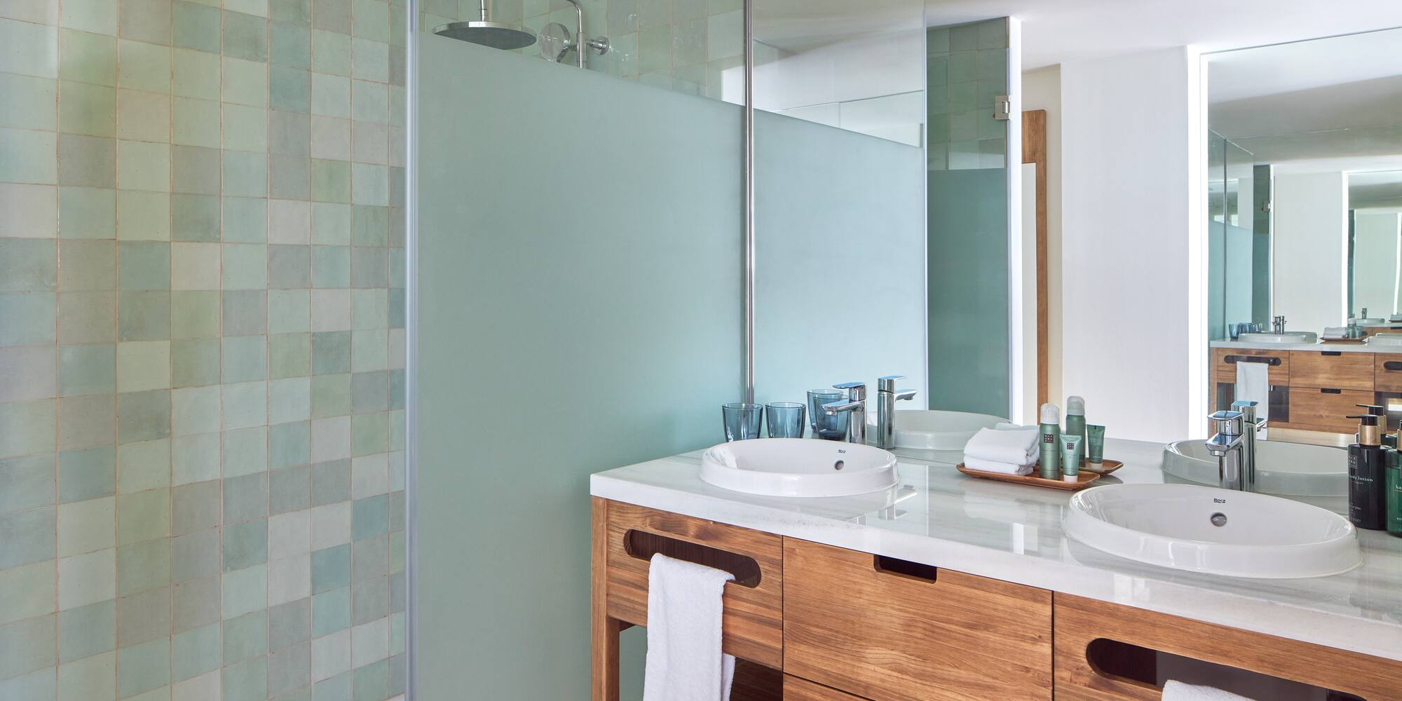 a bathroom with a shower and sink