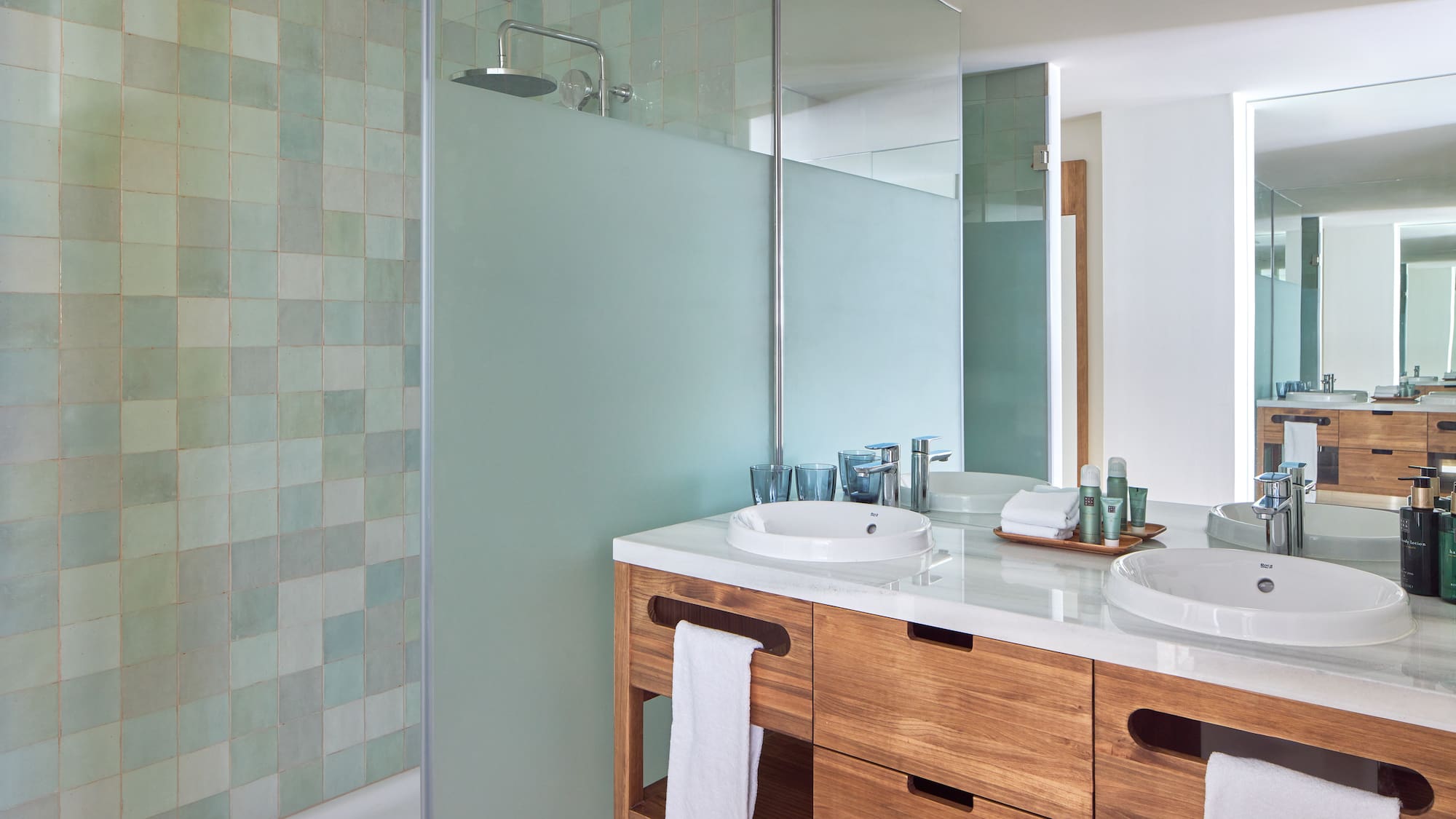 a bathroom with a shower and sink