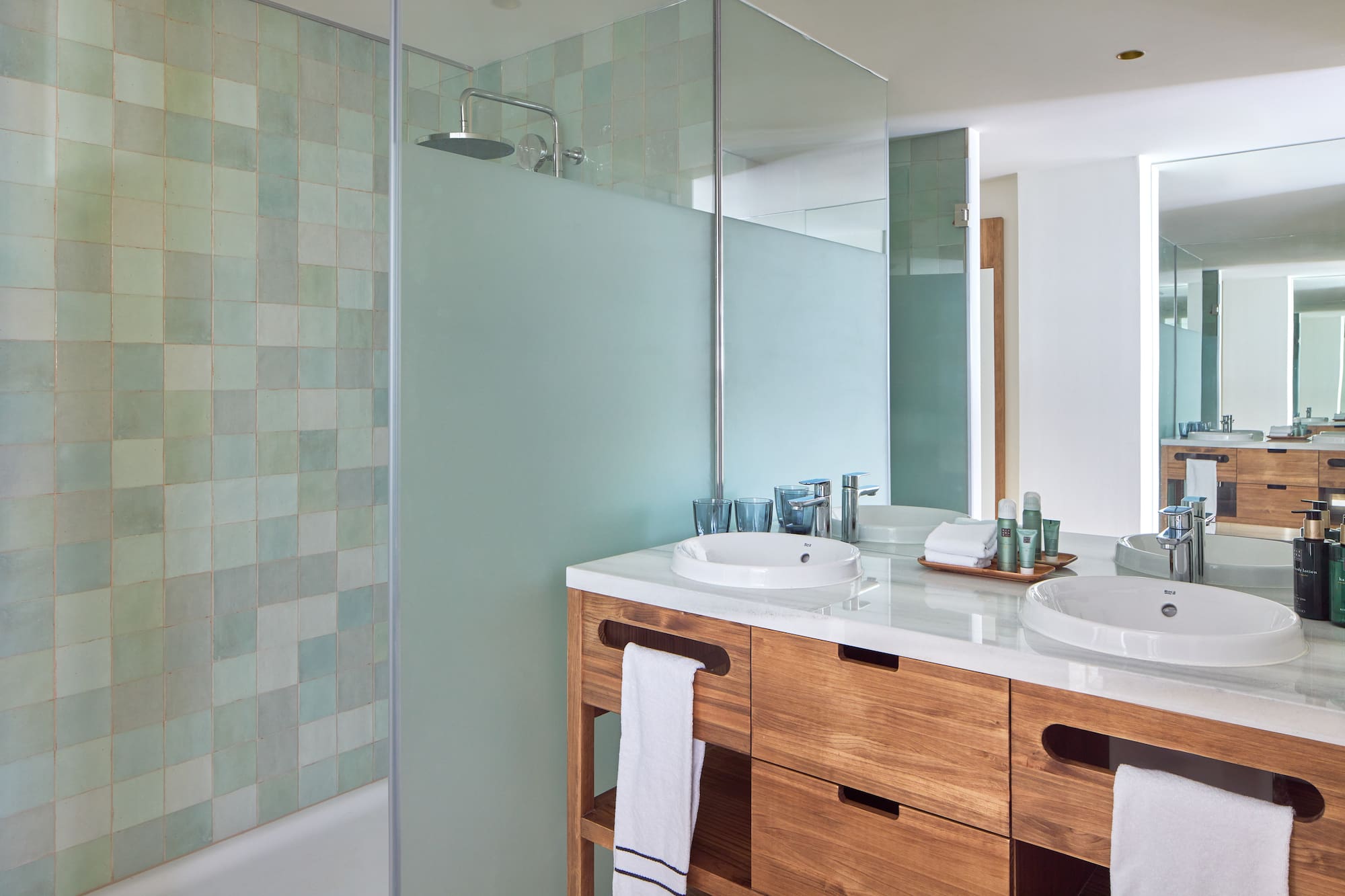 a bathroom with a shower and sink