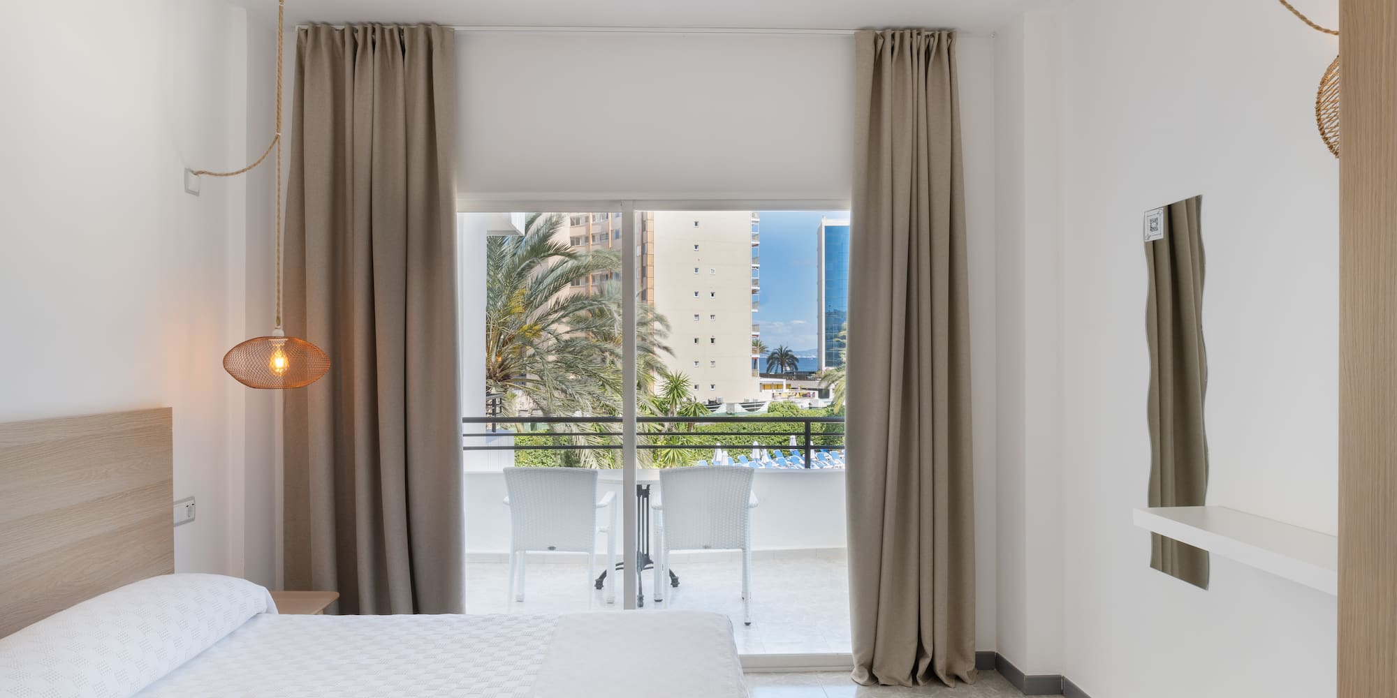 a bedroom with a bed and a ceiling fan