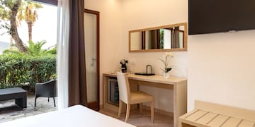 a room with a bed and a television