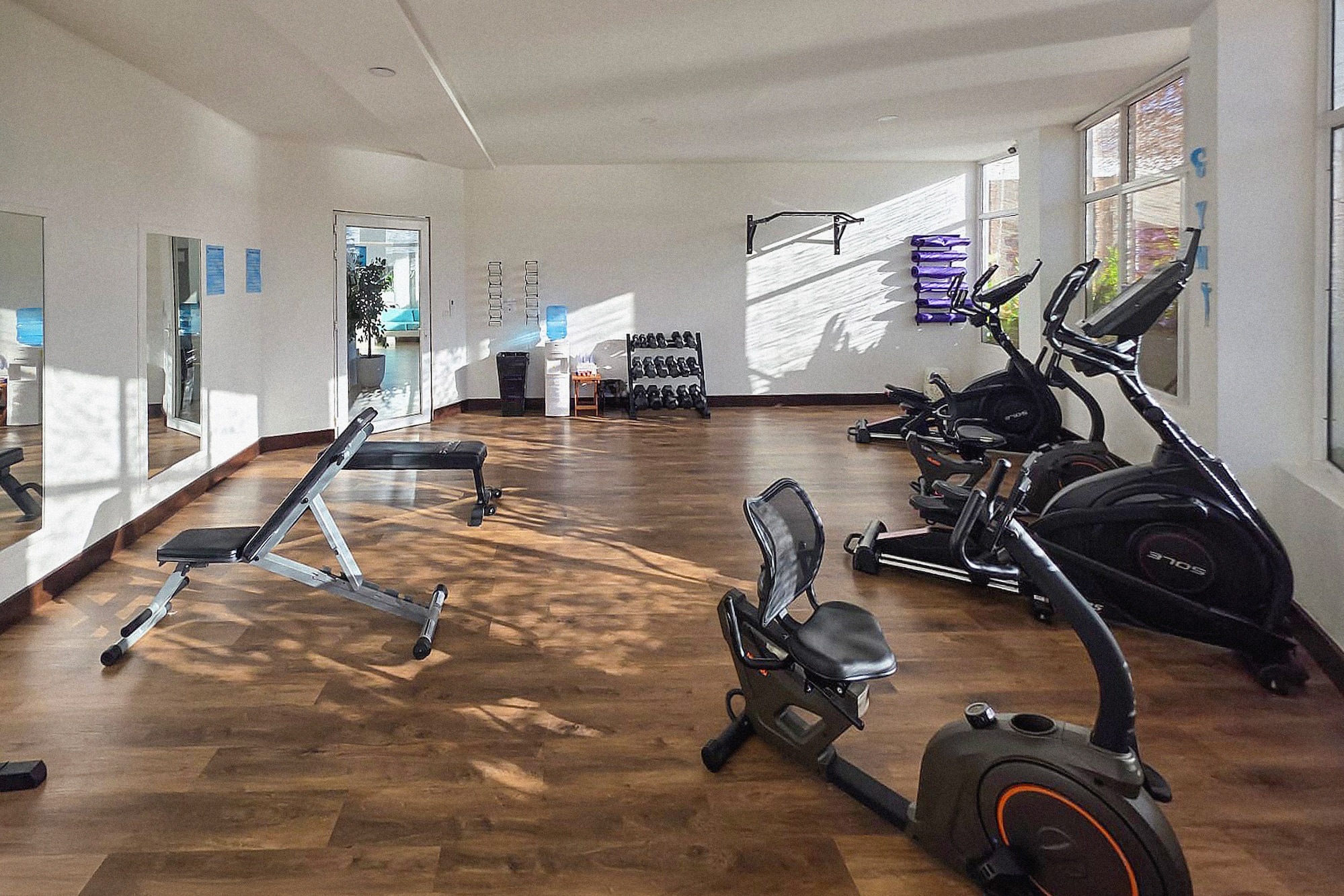a room with exercise bikes and exercise equipment
