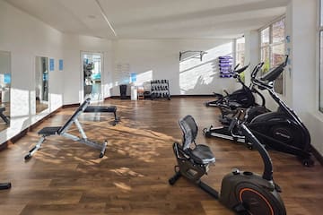 a room with exercise bikes and exercise equipment