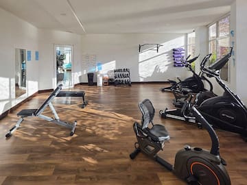 a room with exercise bikes and exercise equipment