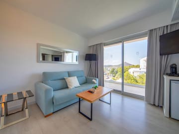 a living room with a couch and a table