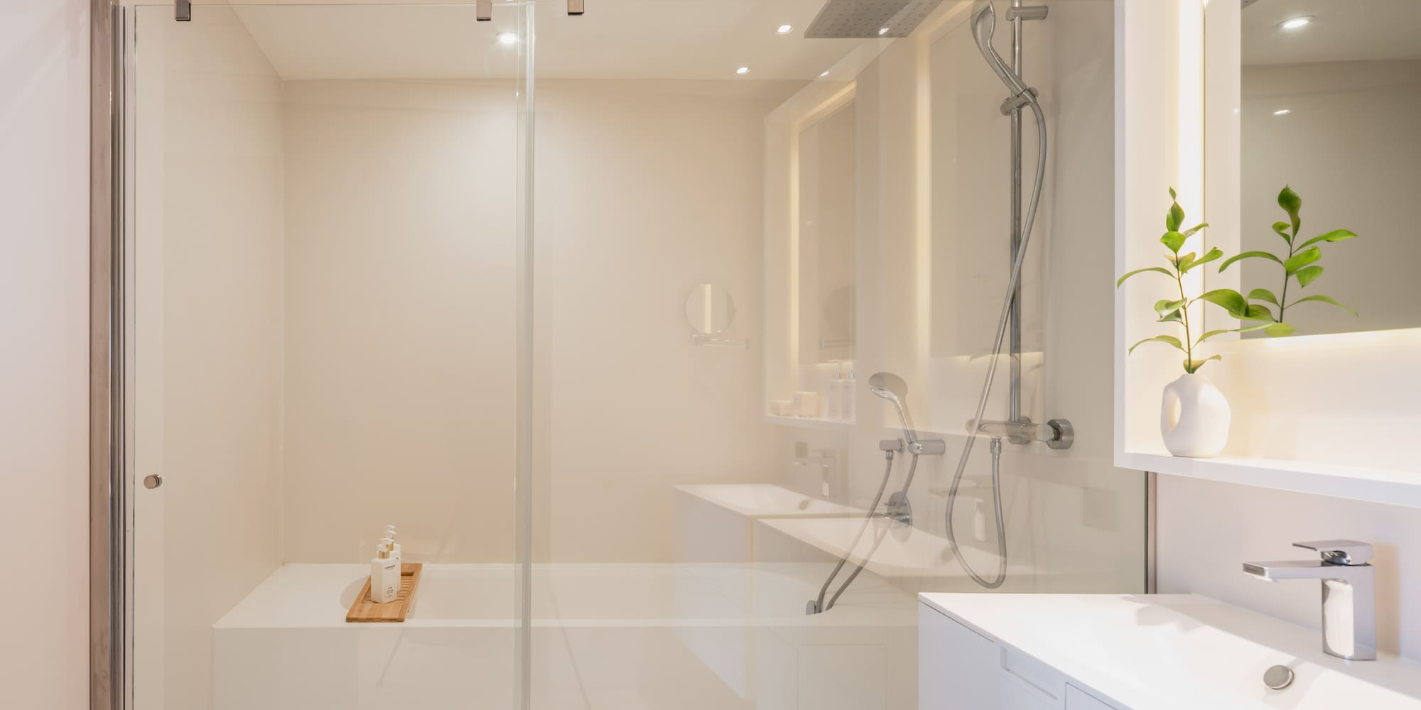 a bathroom with a glass shower door