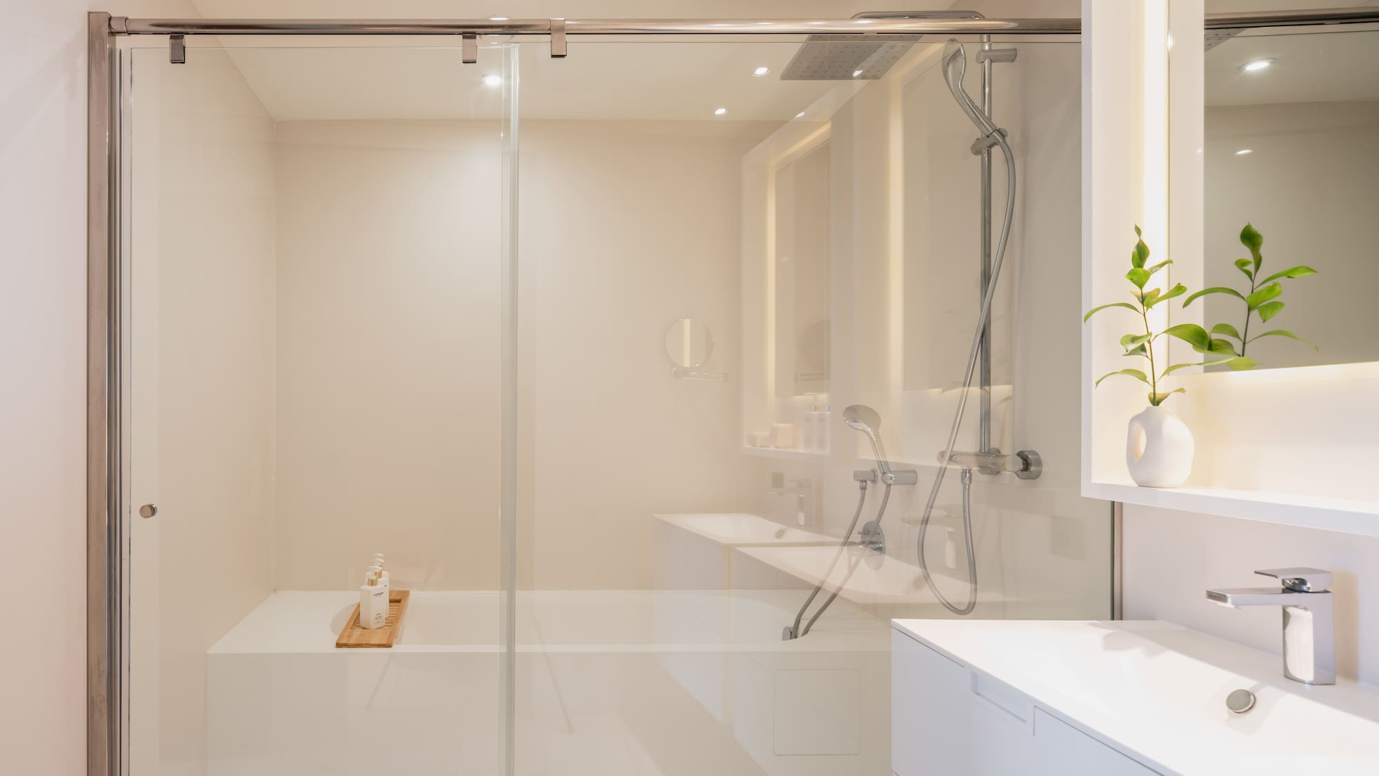 a bathroom with a glass shower door