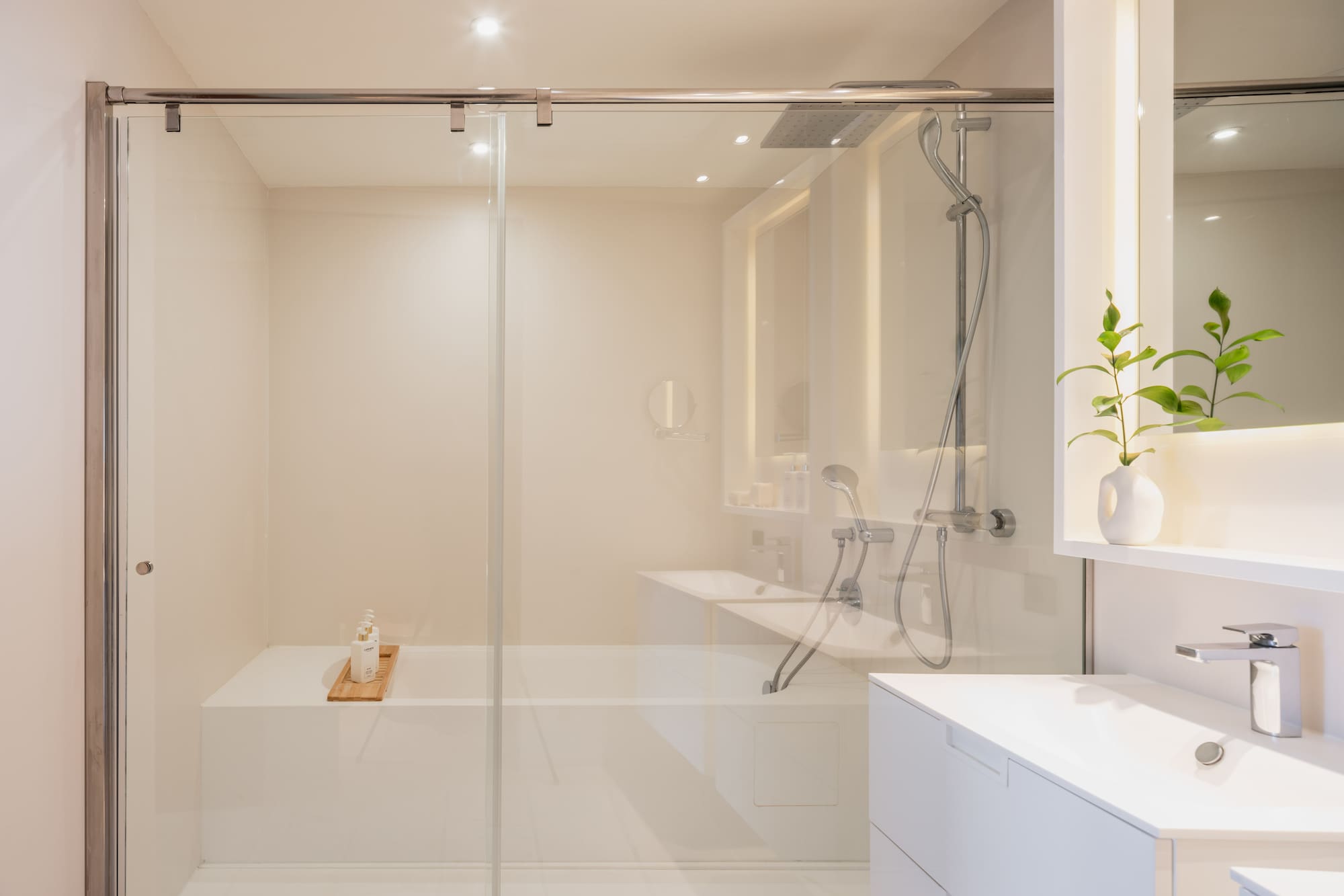 a bathroom with a glass shower door