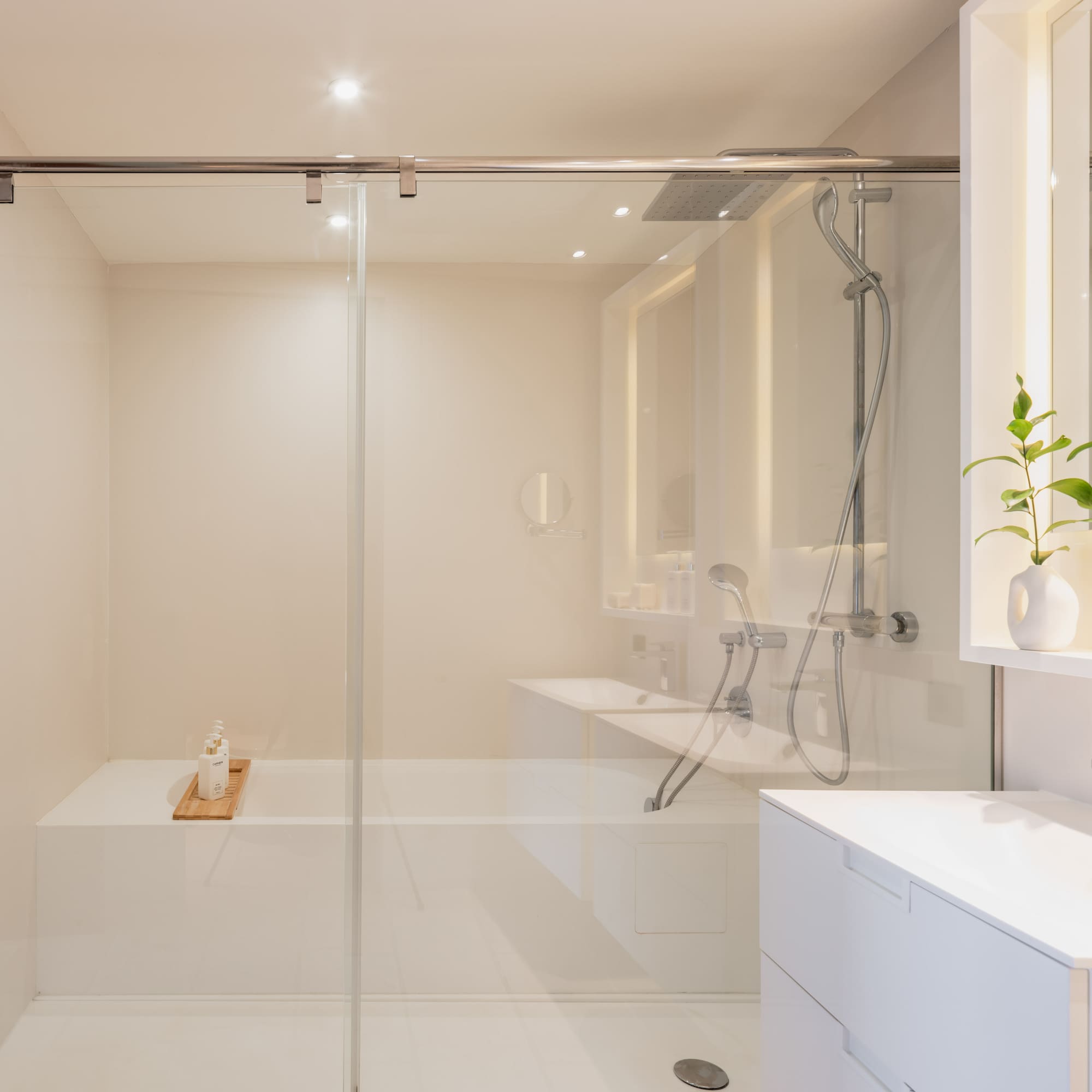 a bathroom with a glass shower door