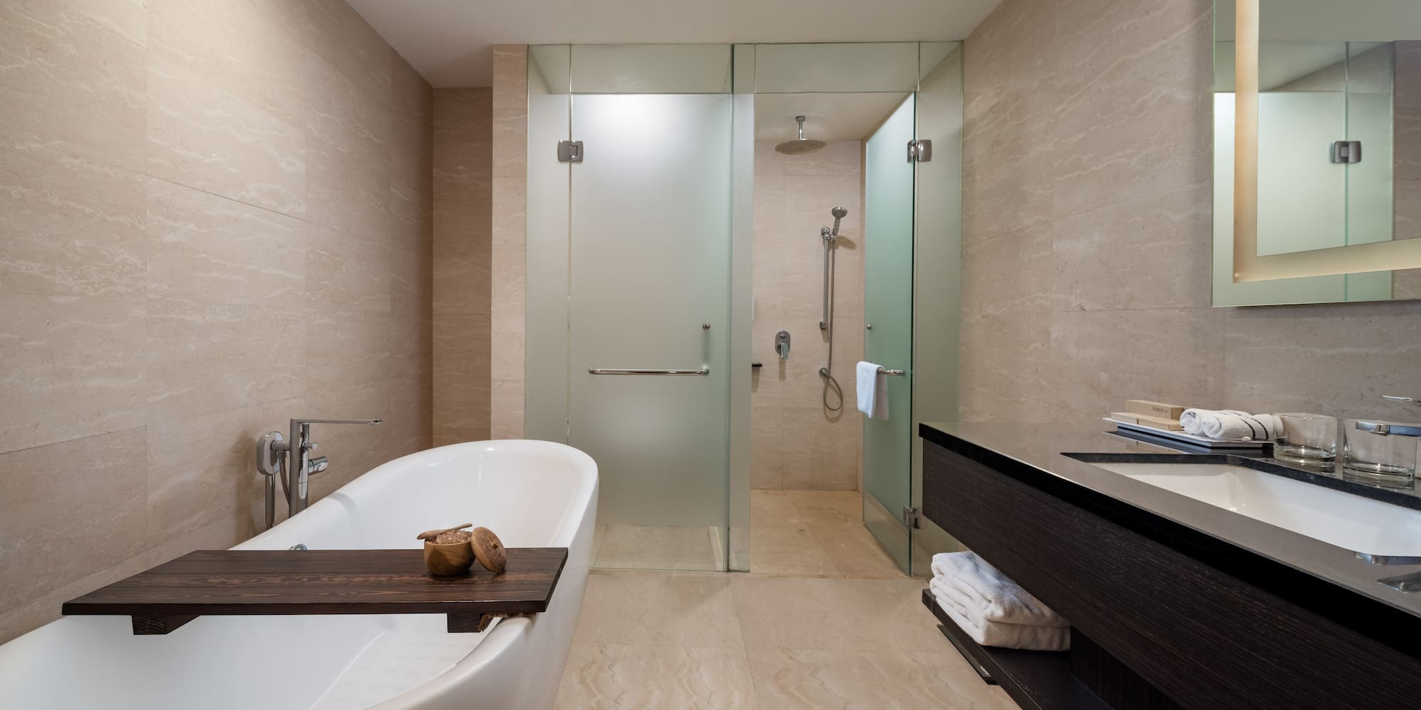 a bathroom with a bathtub and shower