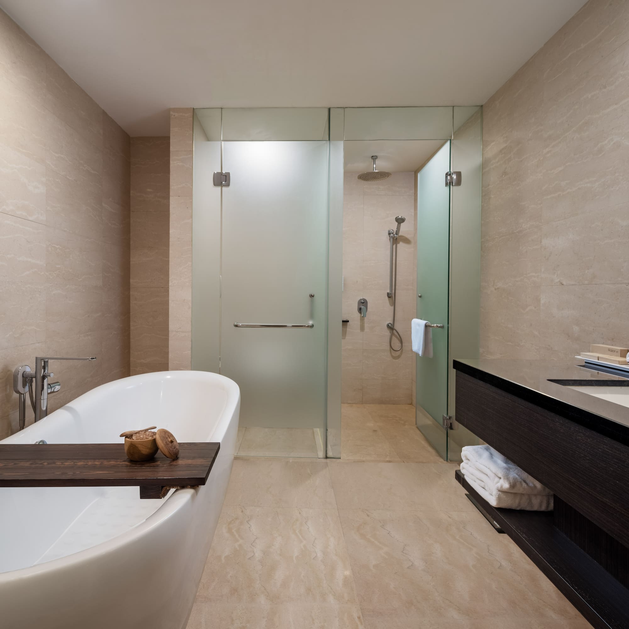 a bathroom with a bathtub and shower