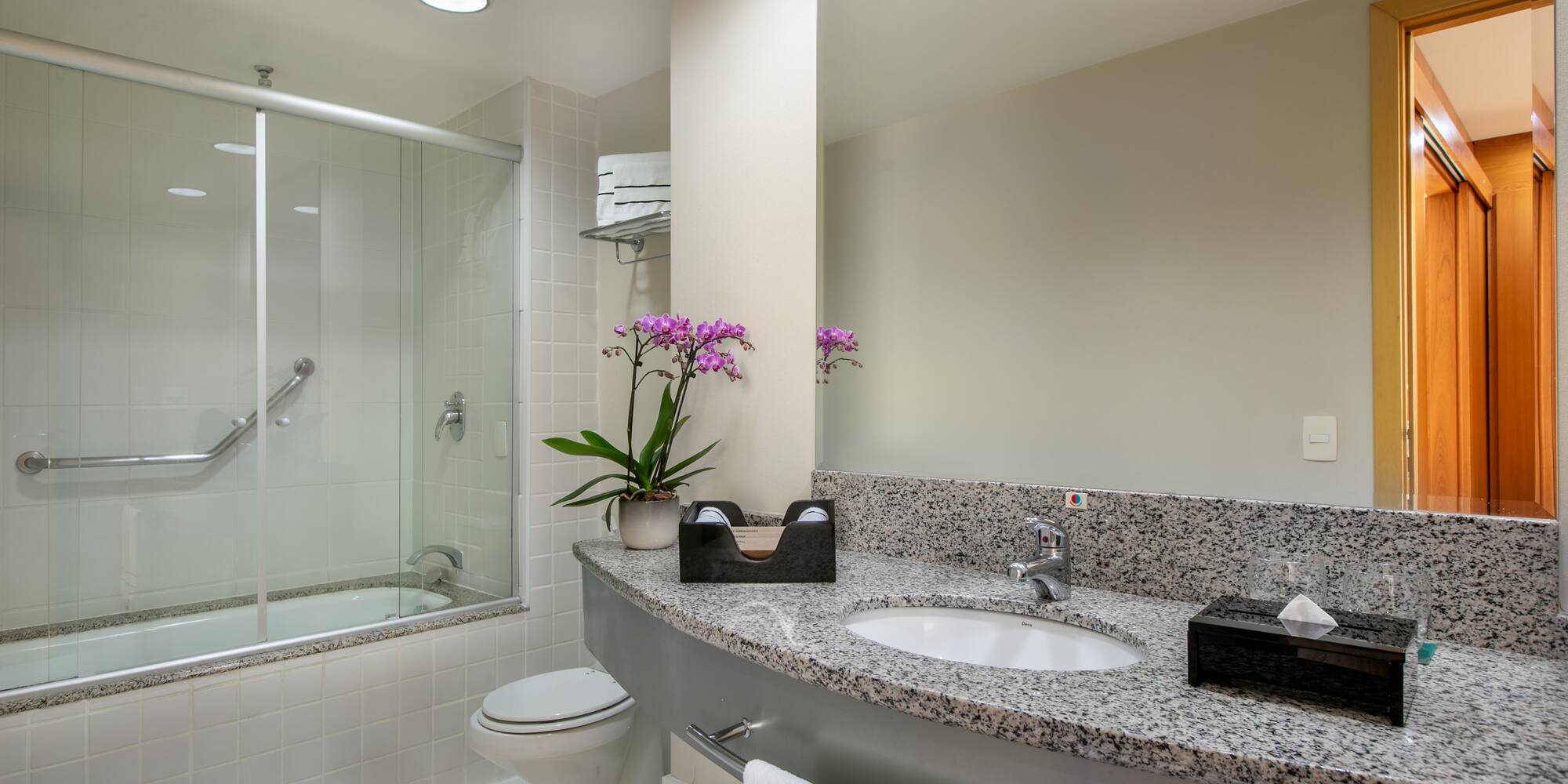 a bathroom with a sink and shower