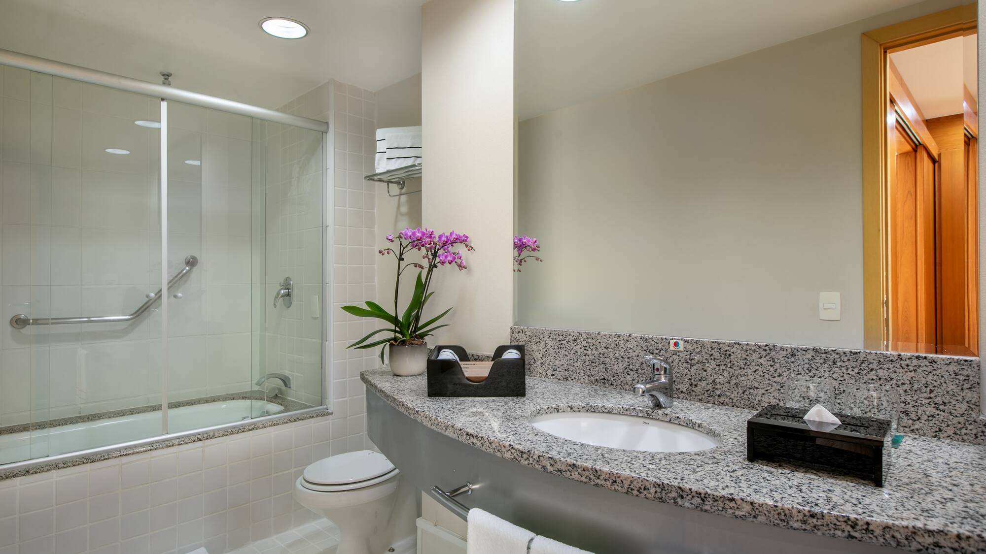 a bathroom with a sink and shower