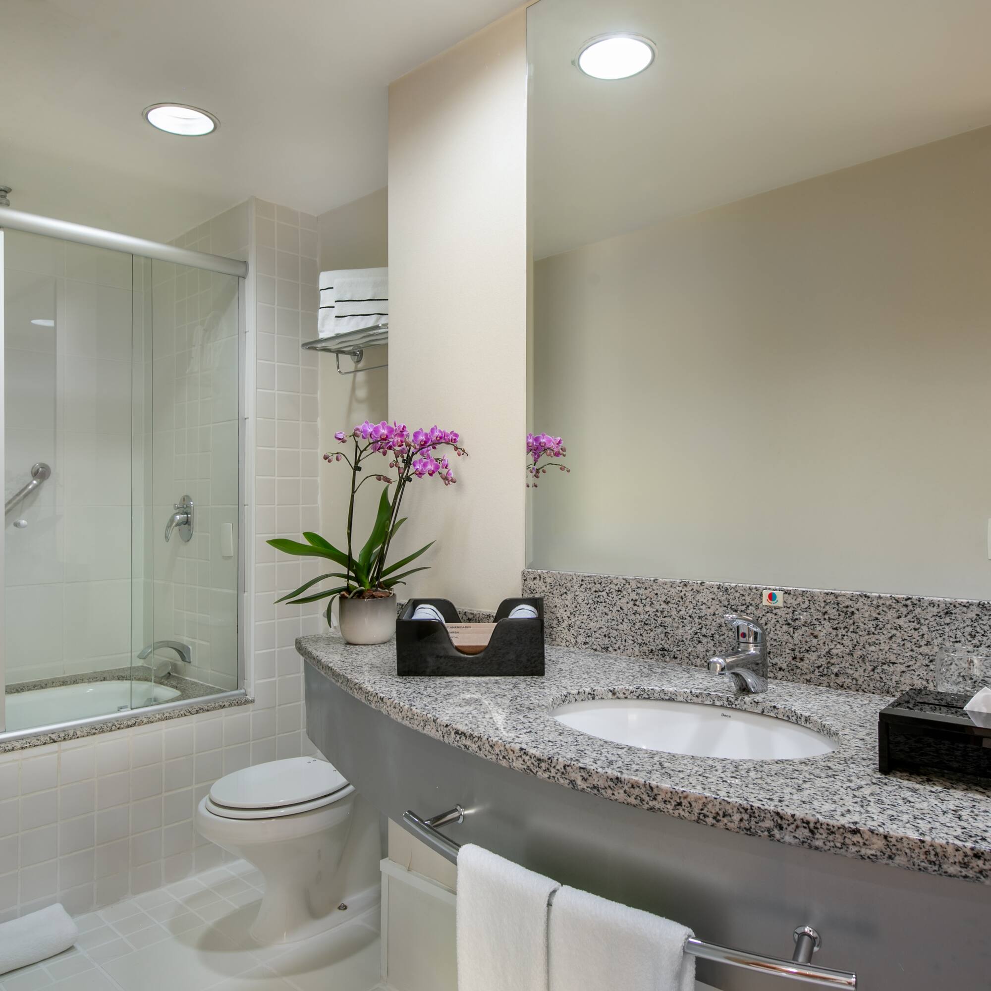 a bathroom with a sink and shower