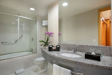 a bathroom with a sink and shower