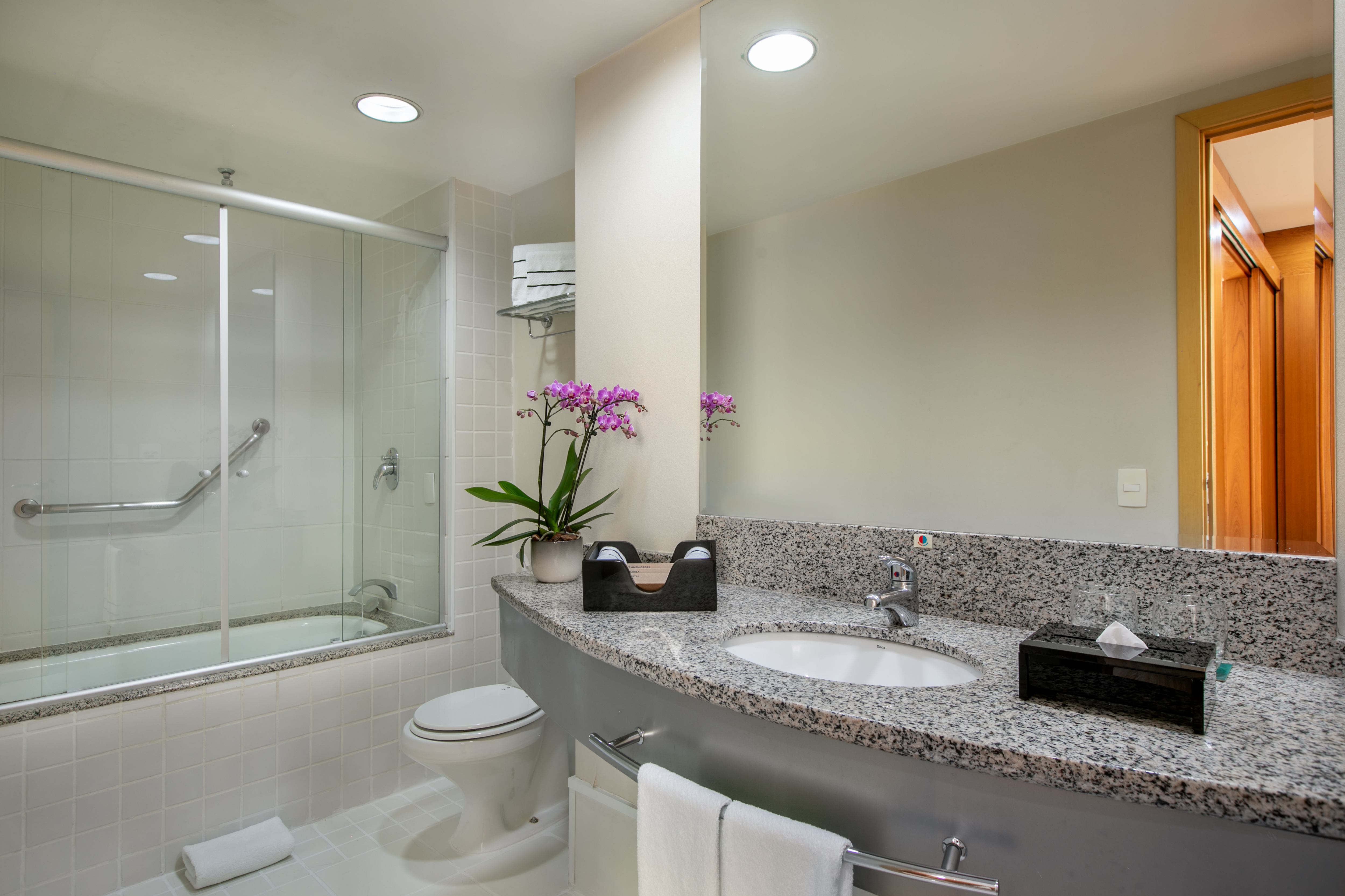 a bathroom with a sink and shower