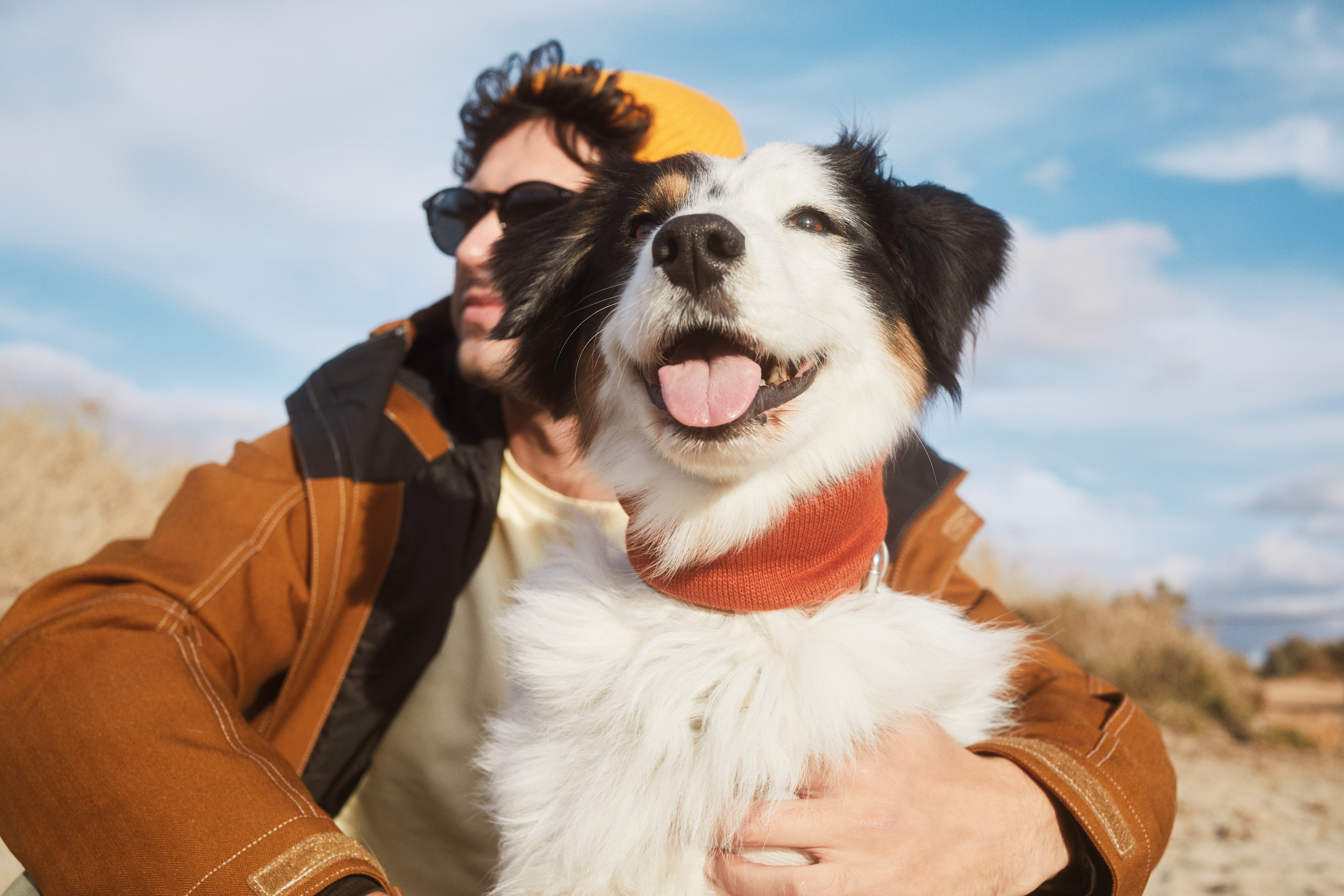 a man holding a dog