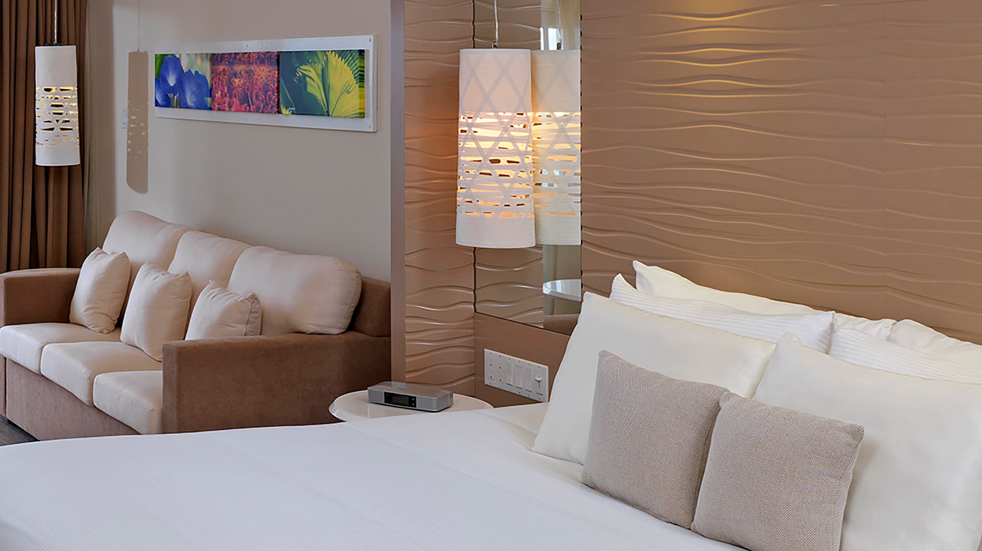 a bed and couch in a hotel room