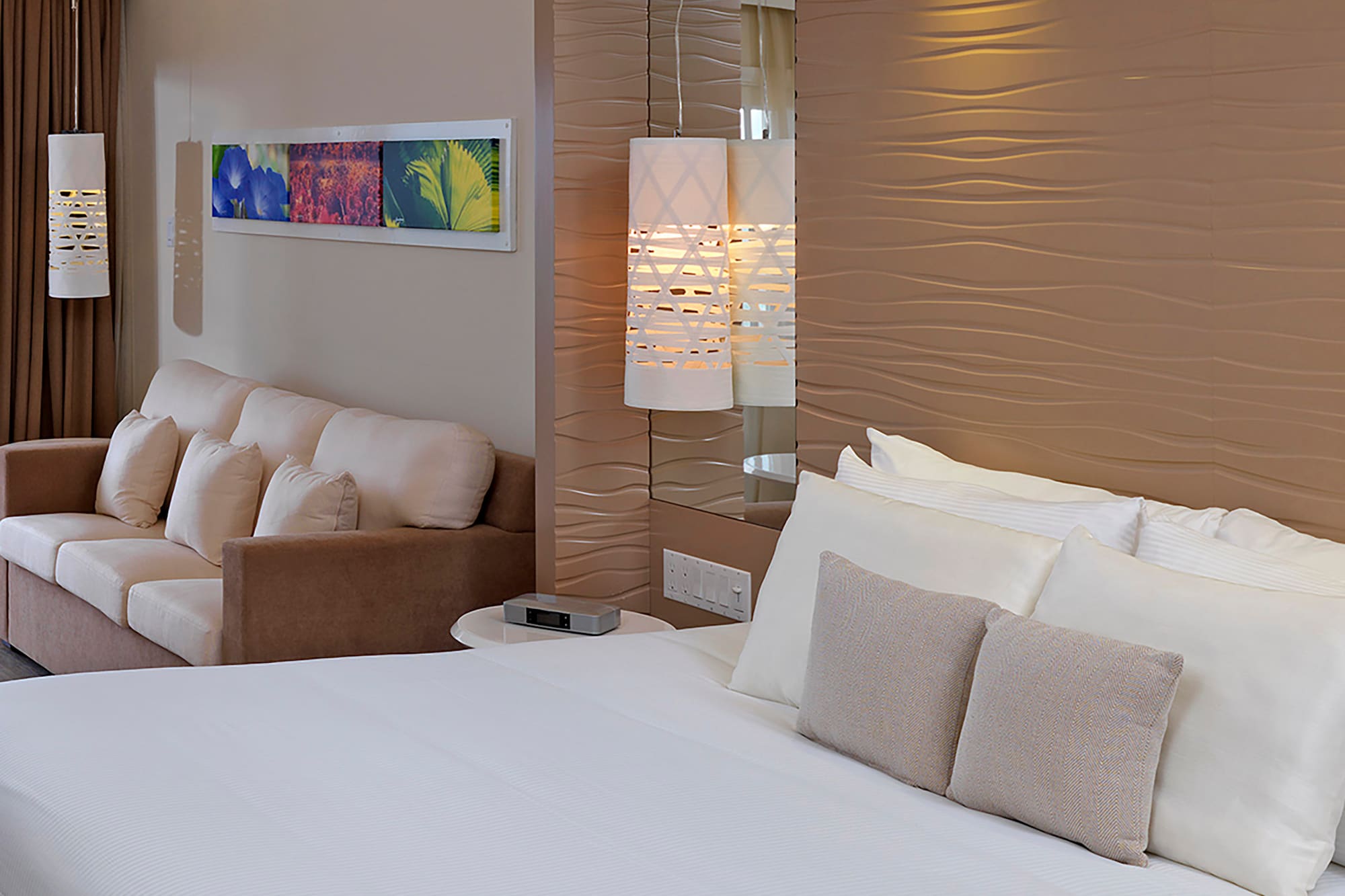 a bed and couch in a hotel room