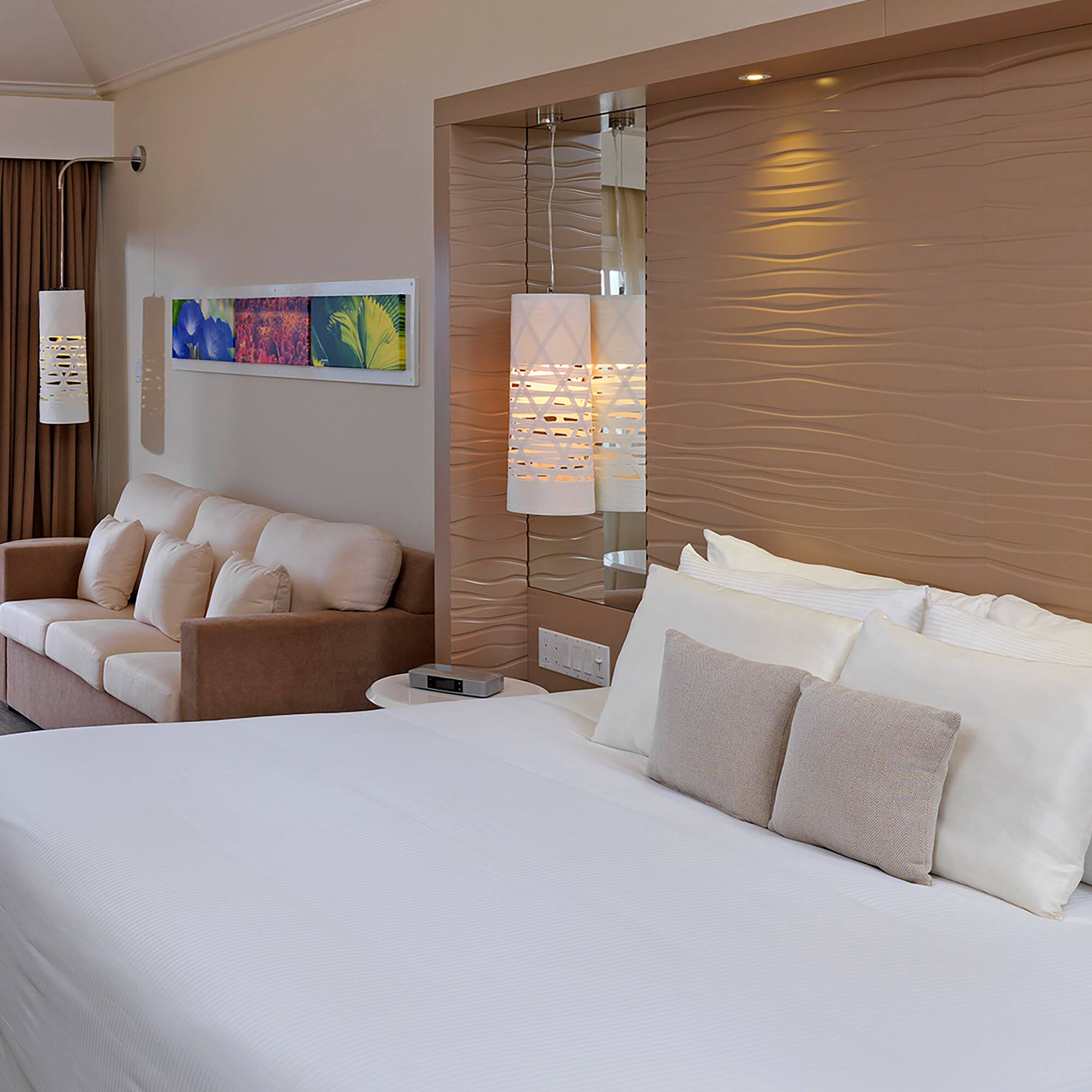 a bed and couch in a hotel room