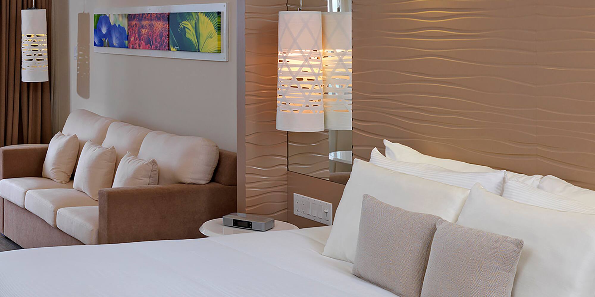 a bed and couch in a hotel room