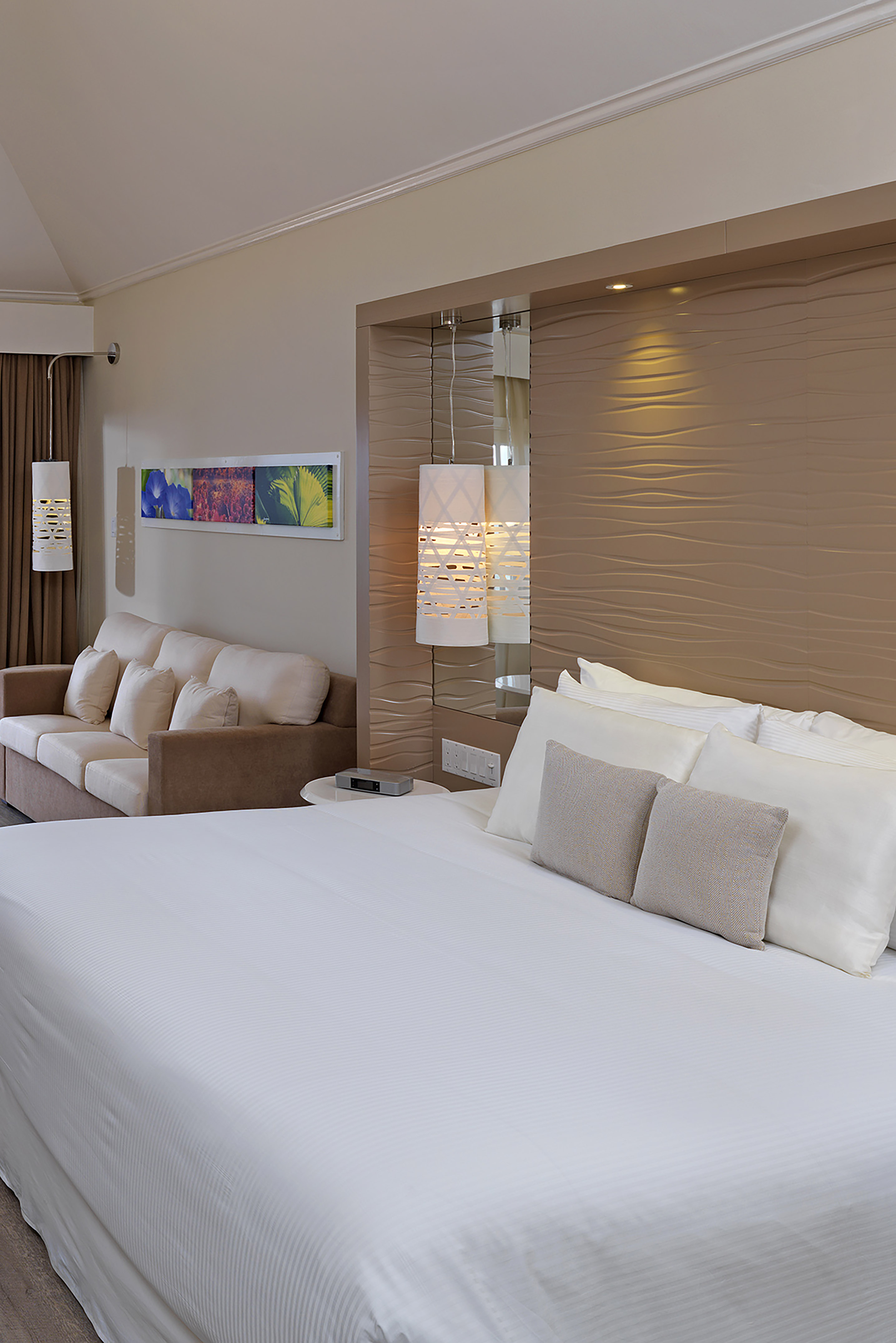 a bed and couch in a hotel room