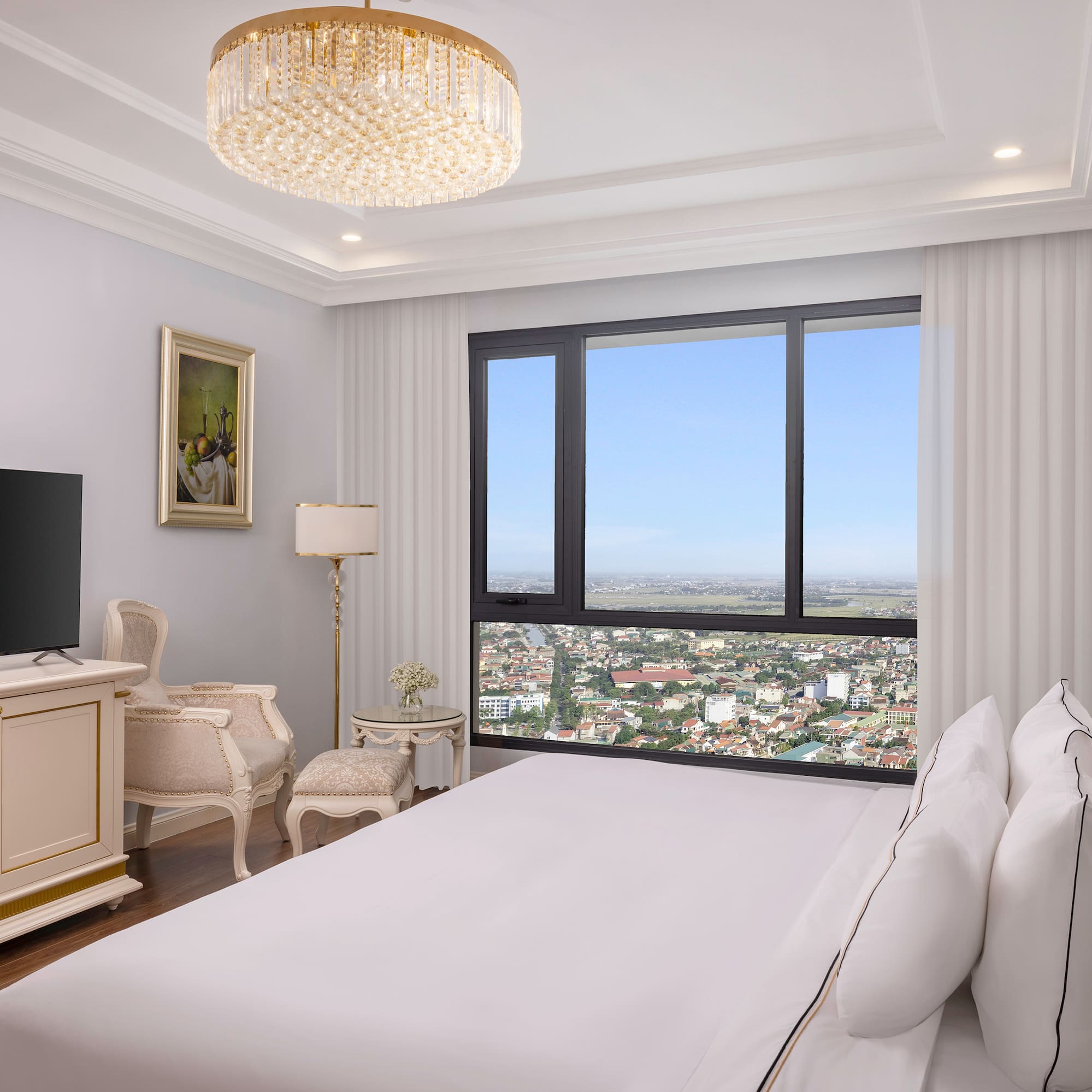 a bedroom with a large window and a large bed