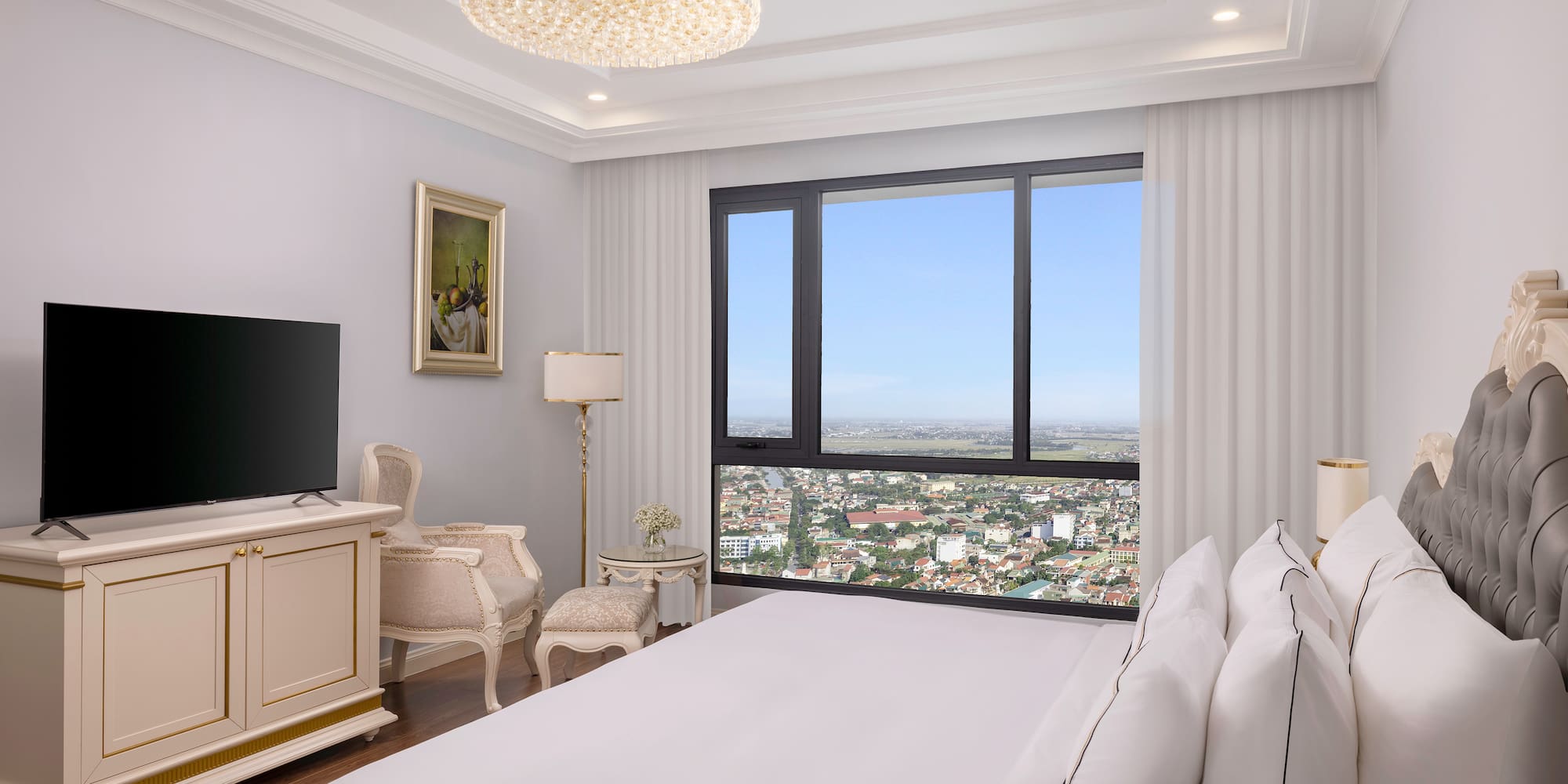 a bedroom with a large window and a large bed