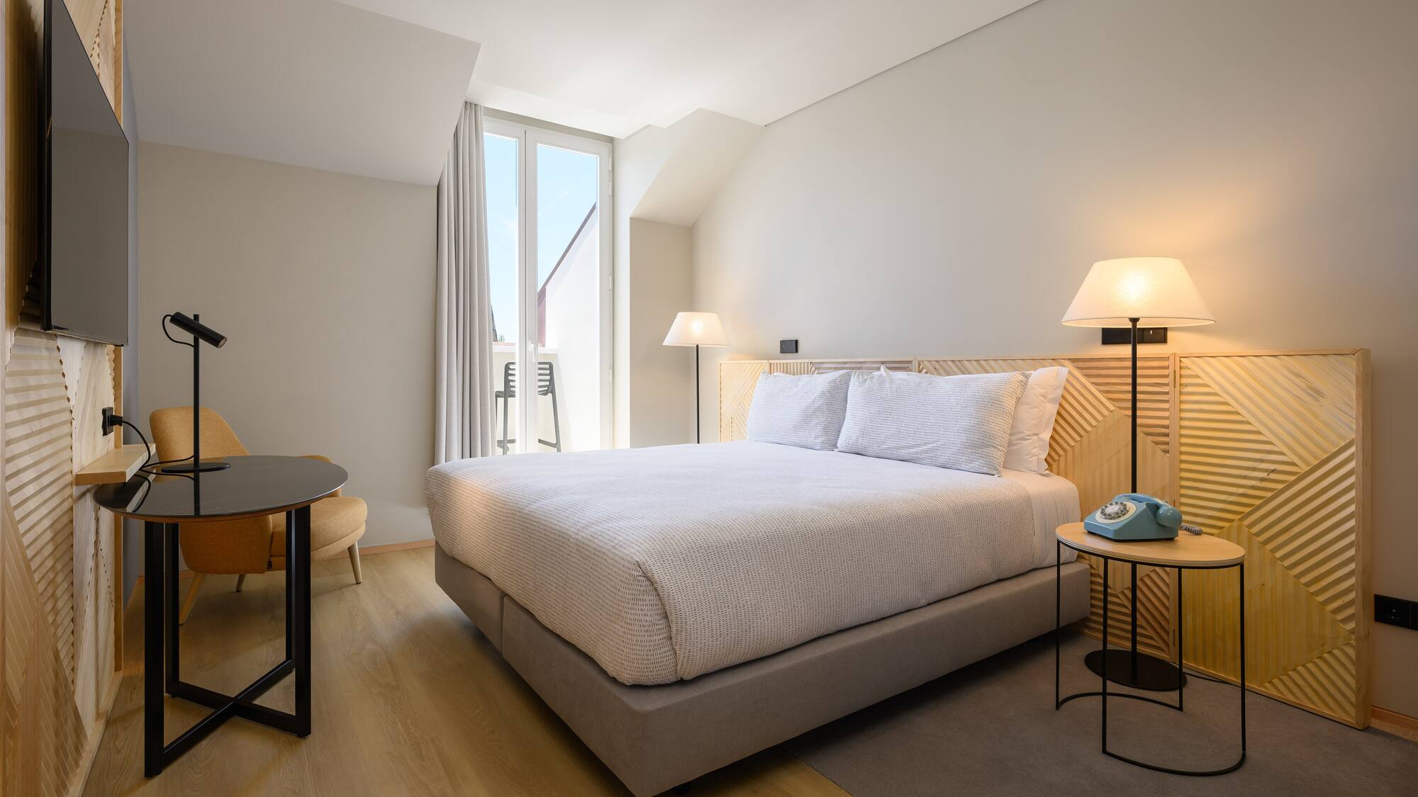 a bedroom with a bed and a table