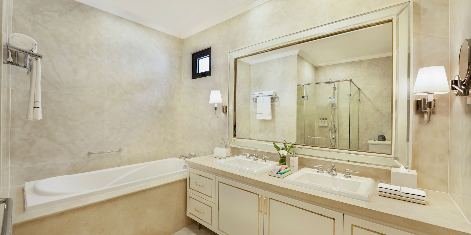a bathroom with a large mirror and sink