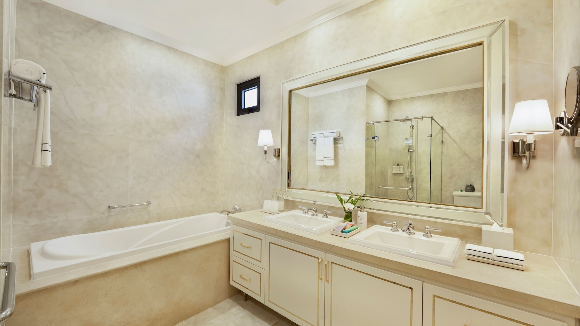 a bathroom with a large mirror and sink