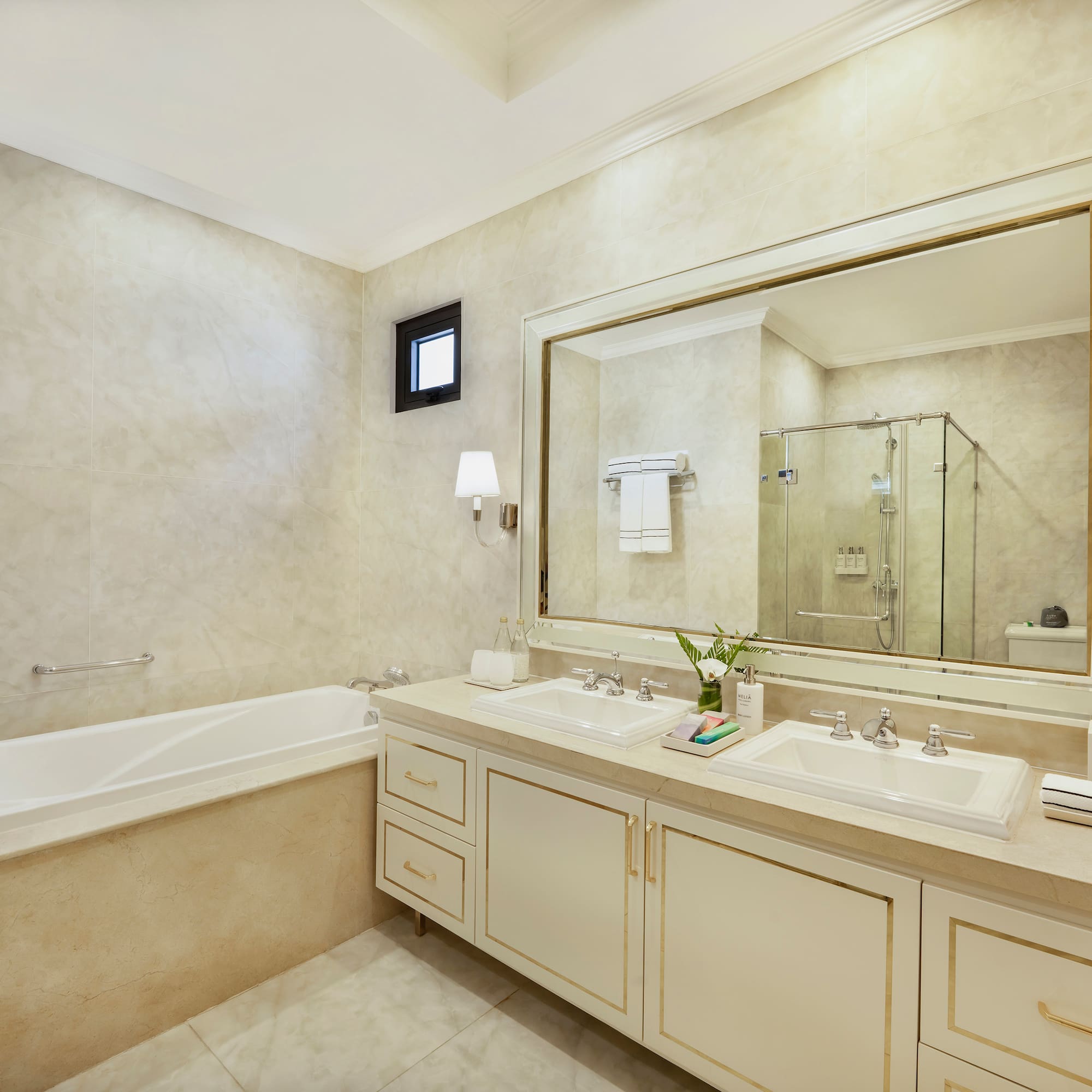 a bathroom with a large mirror and sink