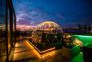 a dome shaped building with lights